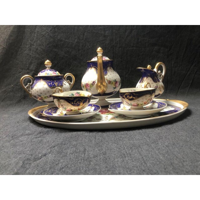 A most wonderful porcelain tête-à-tête "Marquise de Sevigne" stamped on the tableware the decorating workshop Goumot...