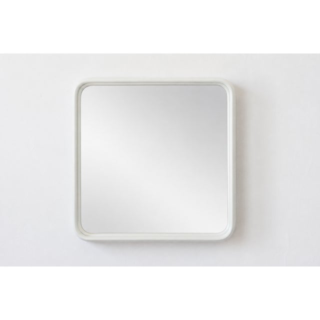 An elegant Italian vintage mirror with a soft, rectangular shape and characteristically rounded corners. The simple,...