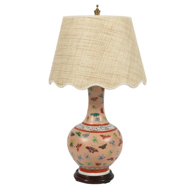 A pair of pink Chinese porcelain lamps with butterflies