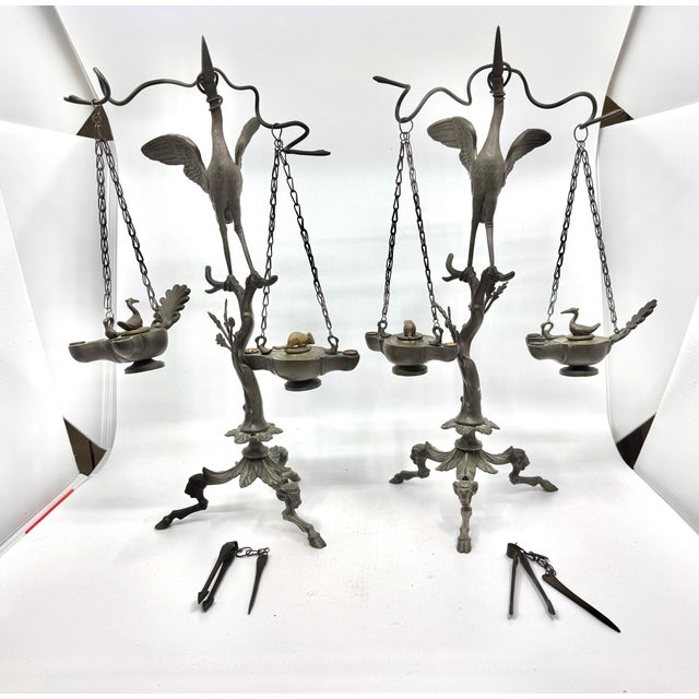 A wonderful pair of bronze neoclassical grand tour souvenir oil lamp after the Pompeiian antiques. These lamps feature a...