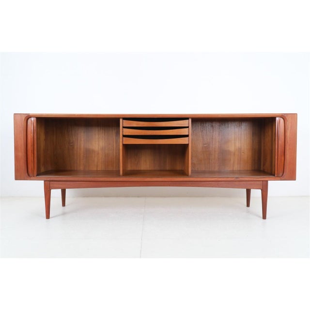 1960s-1970s, Bernhard Pedersen, Denmark. Very high-quality workmanship. Teak (veneer and solid parts). with roller shutter...