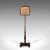This is an antique adjustable pole screen. An English, Rosewood needlepoint fire shield, dating to the Regency period,...