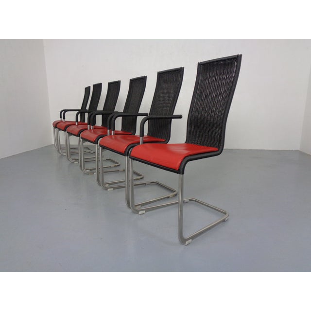 Set of four cantilever chairs with armrests, model D21, and two chairs without armrests, model B20, by Jean Prouve & Axel...