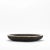 The Lily Bowl in black shagreen with bronze patina brass by R&Y Augousti exudes refined elegance through its striking...