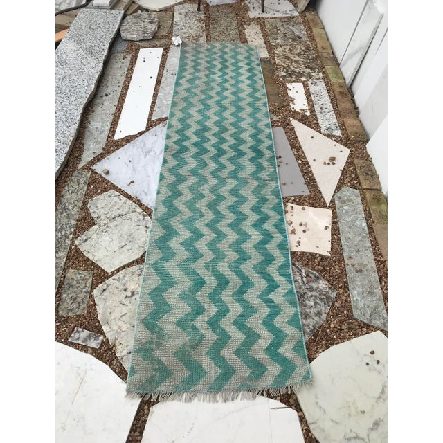 This is made of really soft handspun wool. The rug technique is called a Tulu (meaning long haired). The zigzag offers a...