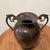 This Vintage Roman Style Amphora Vase/Urn with Jaguar Ornate Handles features a weathered patina finish that adds to its...