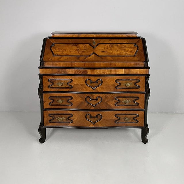 Italian Louis XVI style wooden chest of drawers with decorations, 1950s Wooden chest of drawers with decorations. The...