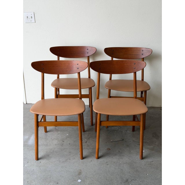 This beautiful set of four vintage Danish dining chairs embodies the clean lines and refined craftsmanship of classic...