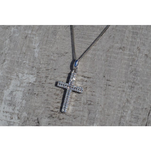 The Gemma Ladies 14K White Gold Diamond Cross Necklace. Dangling from an 18 inch chain is this 0.75 inch cross pendant set...