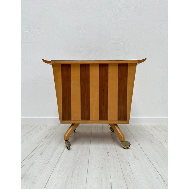 Original vintage bar dresser from the 1950s/1960s. Mirrored bar compartment on the inside with a black glass detail on the...