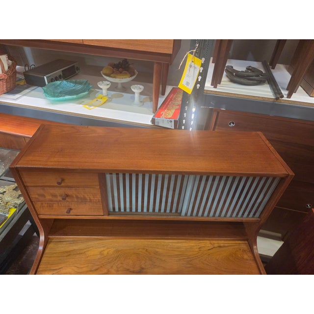 This is a nice teak Danish desk Secretary Desk. Has lots of storage and top pulls out for use. desk top pulled out 13.3...