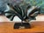 Large signed abstract sculpture by Zaki featuring dramatic biomorphic folded forms in a dark metallic green-black finish....