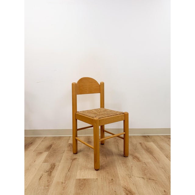 This clean and well-made vintage Hank Lowenstein style mid-century modern blonde dining chair is a solid and collectible...
