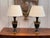 A handsome pair of Empire style table lamps, each modeled as a classical urn in dark patinated bronze with a pleasing...