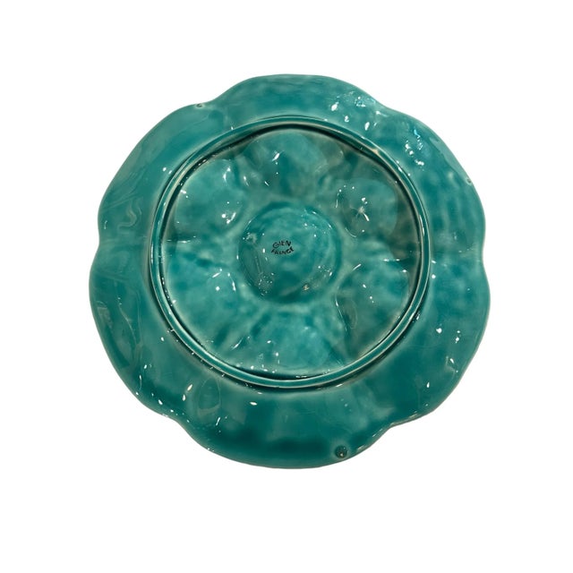 Lovely vintage french oyster plates in a sea green color by Gien. Perfect for table setting or as decor on the wall.