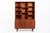 This Danish modern teak bookcase cabinet was designed by Peter Løvig Nielsen and produced by Løvig Dansk Designs in...