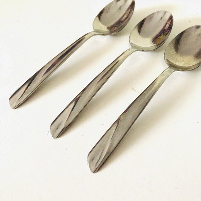 Midcentury stainless set of 3 teaspoons,6"L makers mark reads' Insico Stainless USA" The Finlandia " Pattern, good condition.
