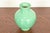 A gorgeous Arts & Crafts period glazed art pottery vase with low relief leaping stag and floral decoration By Rookwood...