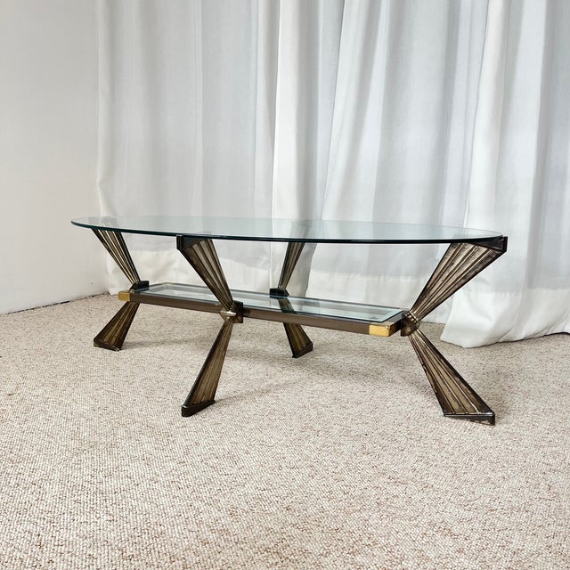 Vintage Italian Glass Coffee Table, Chrome & Brass Metal, Hollywood Regency Style, 1970s A vintage piece from the 1970s...
