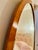 This antique Biedermeier mirror is oval in form. The antique mirror glass has a lovely beveled edge all the way around,...