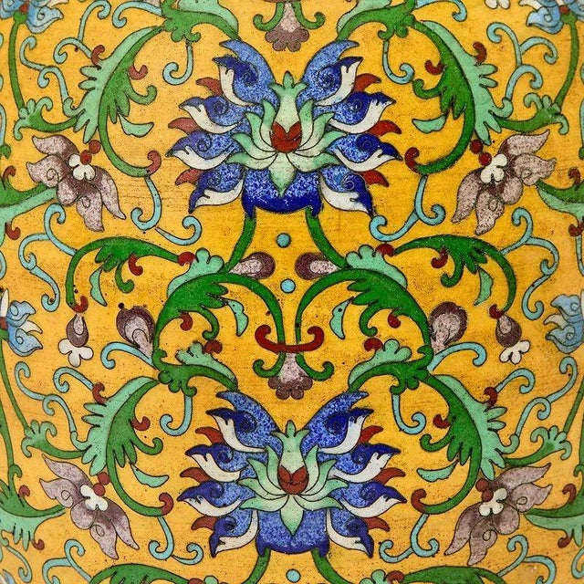 The product is a pair of Chinese yellow cloisonné vases, adding a touch of elegance and traditional charm to any home...