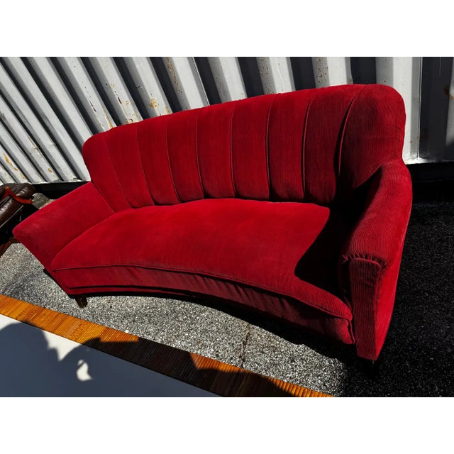 This sofa is made in the Fritz Hansen style. It was made in the Art Deco period (1920-40). It has a curved back and is...