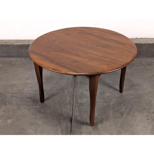 A beautifully crafted example of mid-century modern design, this vintage 1960s solid teak coffee table showcases...