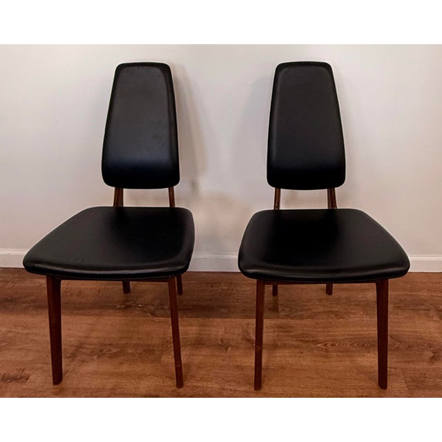 An elegant pair of Danish modern high-back dining chairs designed by Erik Buch and manufactured by O.D. Møbler in Denmark....