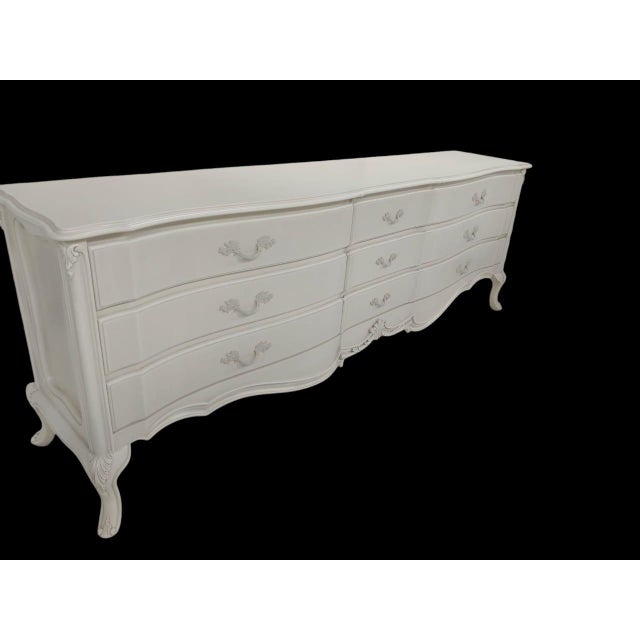 Transform your bedroom into a sanctuary of classic elegance with this breathtaking French Provincial triple dresser....