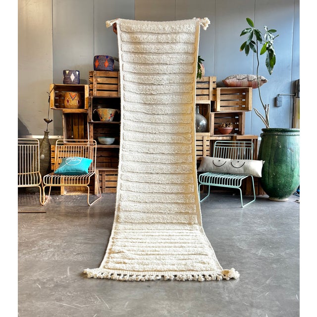 This brand new Beni Ouarain runner rug is a refined and minimalist piece, handwoven in the Atlas Mountains of Morocco...