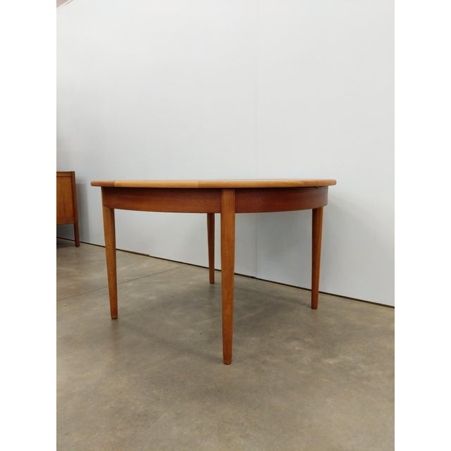 Authentic vintage mid century modern teak extendable dining table with 1 built-in leaf. This piece is in excellent...