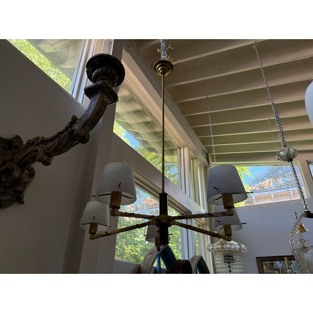 Italian Modern Brass Chandelier. Offered is a stylish Italian mid-century modern 5 light brass chandelier. Each arm of...