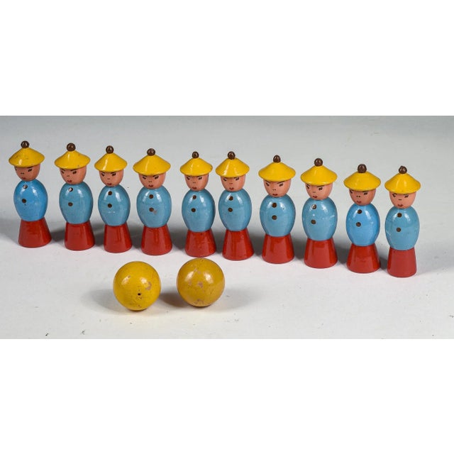 Toy game from the 1940s by gurman of matelica, 1950s bowling skittles game consisting of 10 figures with yellow hats, 2...