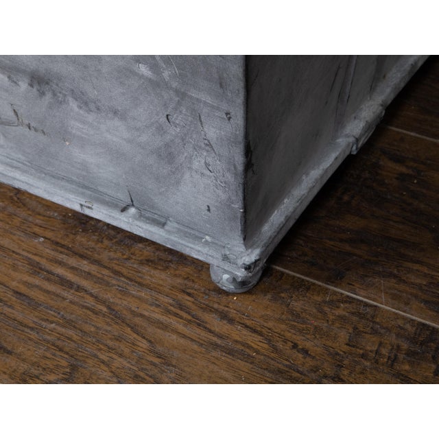 A pair of contemporary American metal cache pot planters from the 21st century with tapered lines, grey patinated color,...