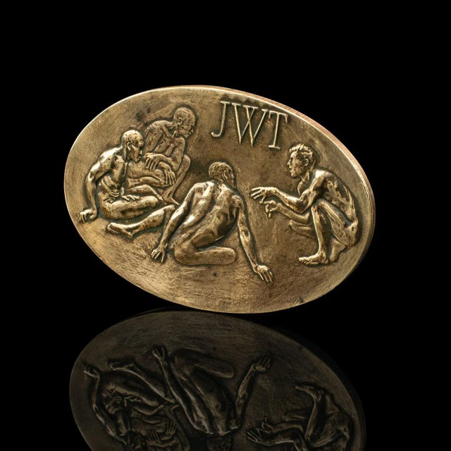 This is a vintage centennial company medallion. An American, bronze corporate anniversary keepsake for the J Walter...