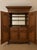 An impressive, oversized home bar armoire combining substantial cabinetry with a fully outfitted entertaining interior....