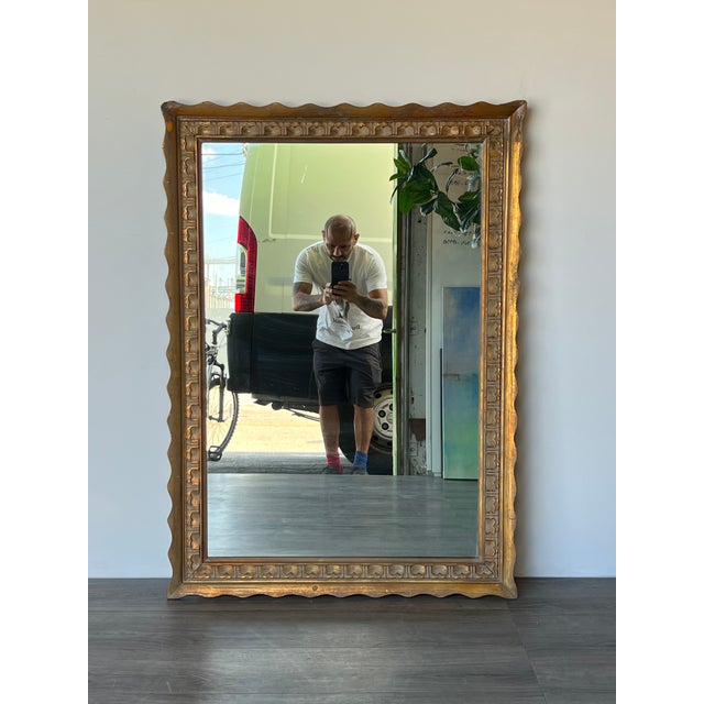 Hollywood Regency giltwood mirror This mirror has minor wear, light scratches and loss to finish Dimensions: 35"Width x...