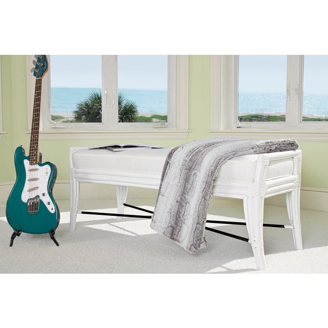 This beautifully designed bench from David Francis features a Rattan frame, leather-wrapped joints and a tight boxed seat...