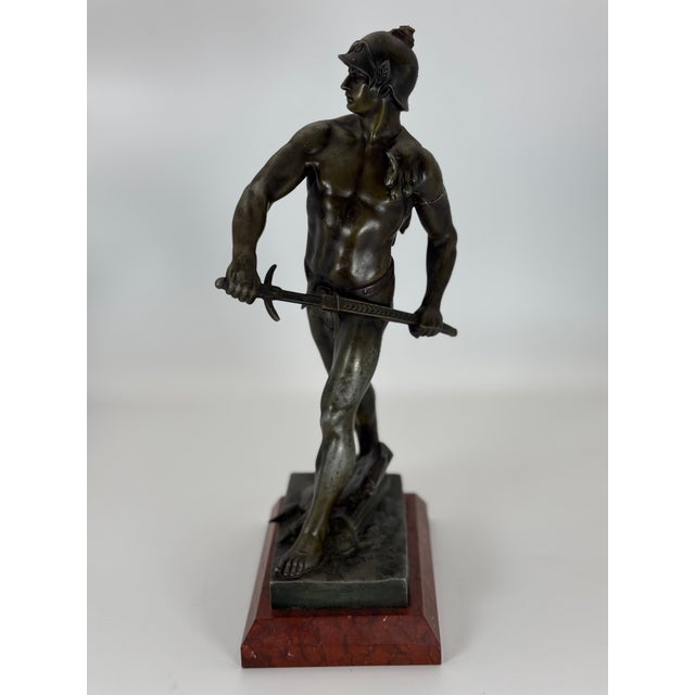 Stunning bronze sculpture by renowned French artist Émile Louis Picault (signed on base), featuring a heroic warrior...