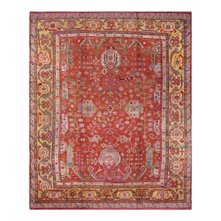 Impressive Coral Red With Palmettes Cross Pattern Antique Turkish Oushak Rug For Sale