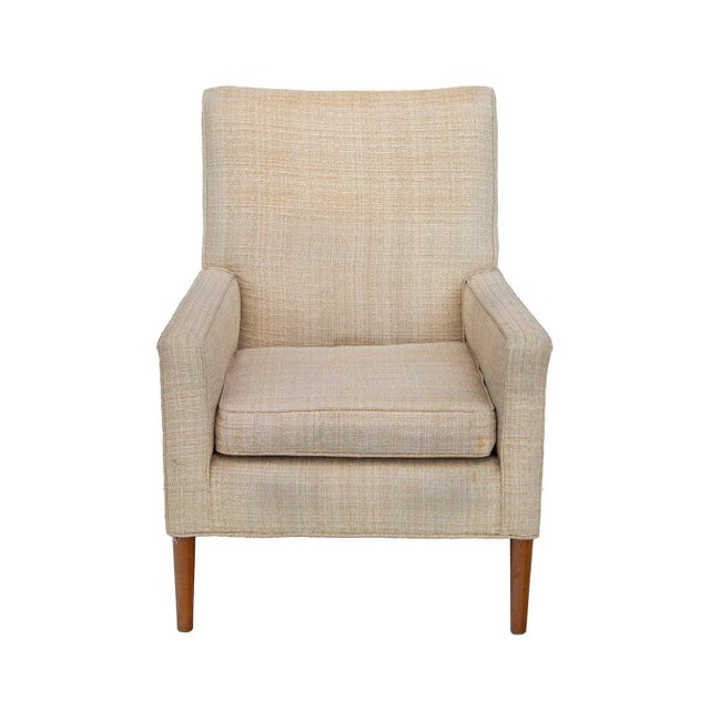 USA, 1950s Mid-century armchair with a nice, moderate scale. Walnut legs- the front tapered dowel and the rear square....