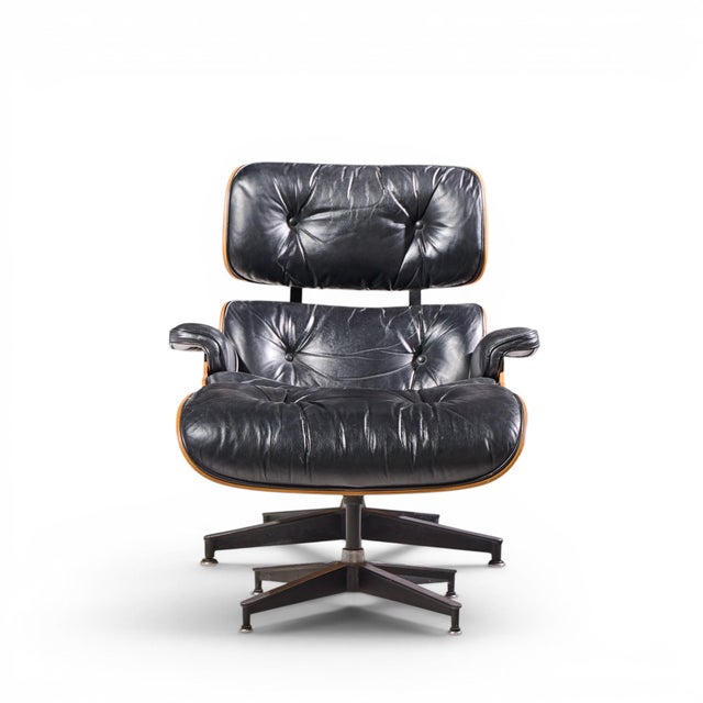 Charles and Ray Eames for Herman Miller Mid Century Rosewood Eames Lounge Chair and Ottoman The chair measures: 31.25 wide...