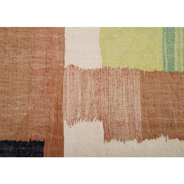 Artistic handwoven wool rug featuring a layered abstract design in Charcoal Black, Amber, Peach, Lime, and Sage Green. Set...