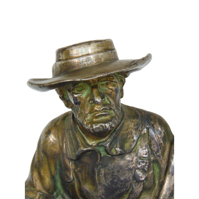 This handsome and impressive resting farmer sculpture definitely makes a statement. This weighty (28 pounds!) spelter...