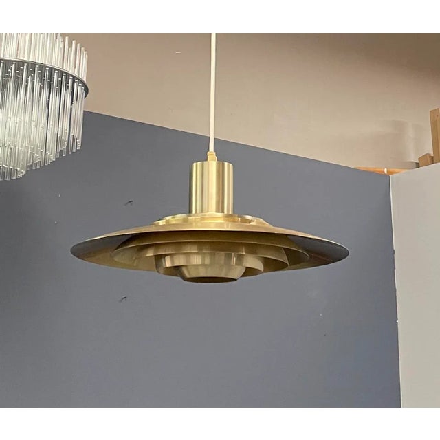 Pendant lamp in brass by Preben Fabricius & Jørgen Kastholm for Nordisk Solar. Designed in 1963. Aluminium base.