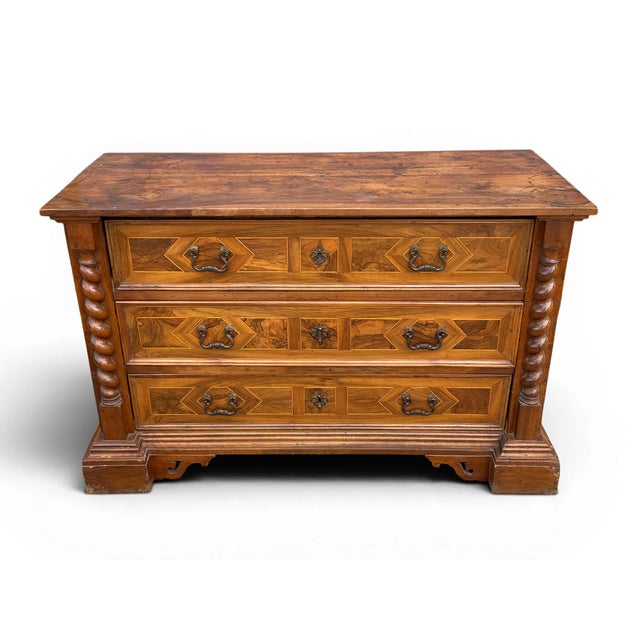 Antique Italian Walnut Commode A fine antique Italian walnut commode, distinguished by its molded lines and solid wood...