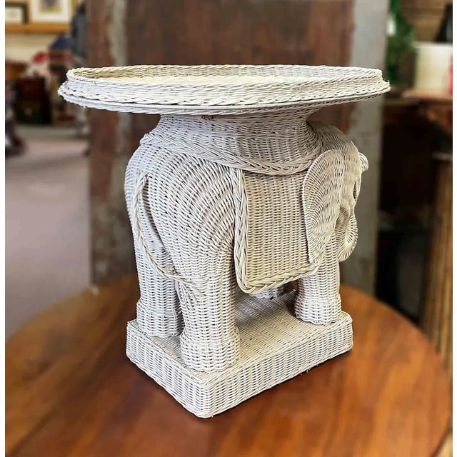 Vintage wicker elephant side table with removable tray. Tray Dimensions:W:16" x D:23" x H:1".