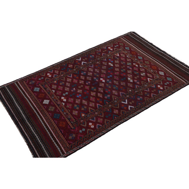 Handwoven in wool circa 1950-1960, this 5x8 vintage kilim is a Baluch rug from Rug & Kilim’s collection of tribal...