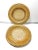 A beautifully crafted set of four vintage woven rattan and cane plate chargers featuring a tightly braided outer rim and...
