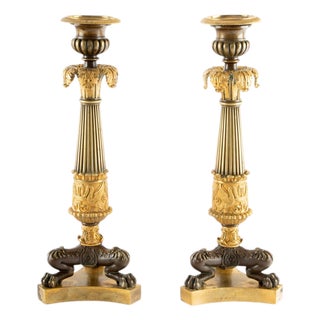 Guardians of the Flame: Pair of Early 19th C Gilt Bronze French Candlesticks For Sale